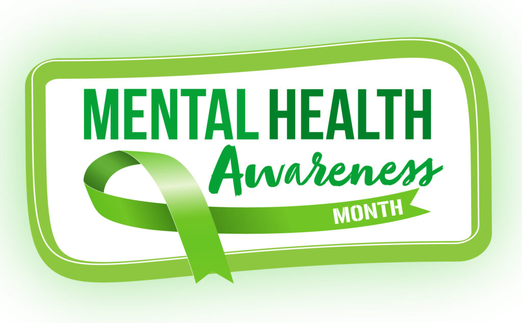 green sign saying "Mental Health Awareness Month"