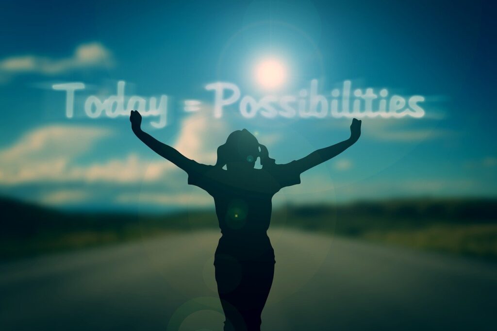 individual with arms reaching wide and "today = possibilities" spelled out in cloud text